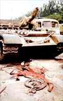 Motorcycle crushed by a tank