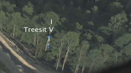 Flyover view of treesit banners preventing blasting at Massey Edwight Mine